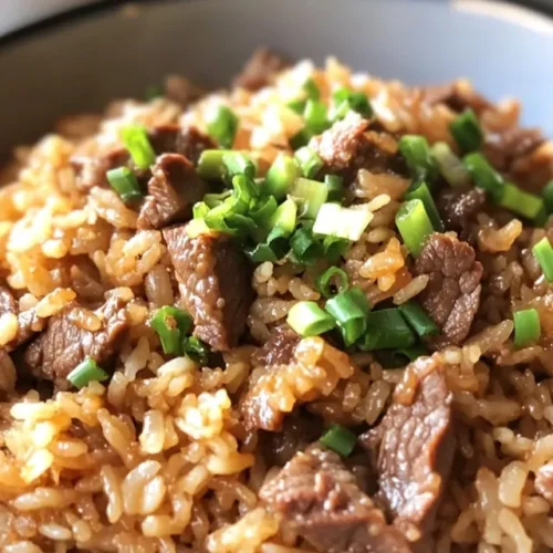 Close-up of onion beef fried rice showing texture and ingredients