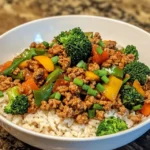Ground turkey cooking with vegetables in wok for healthy stir-fry