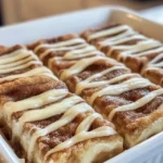 Close-up of cinnamon roll cheesecake bar showing layers