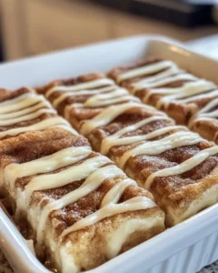 Close-up of cinnamon roll cheesecake bar showing layers
