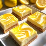 Finished lemon marbled cheesecake bars with fresh berries