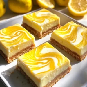 Finished lemon marbled cheesecake bars with fresh berries