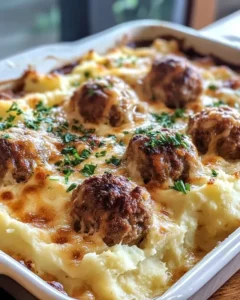 Serving of meatball and mashed potato bake on plate