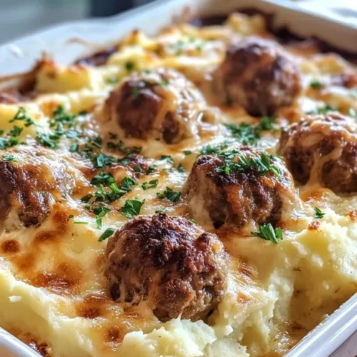 Serving of meatball and mashed potato bake on plate