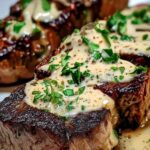 Sliced juicy steak with creamy garlic sauce served with mashed potatoes