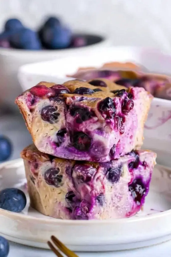 Blueberry cottage cheese breakfast bake golden brown in square baking pan with fresh blueberries on top