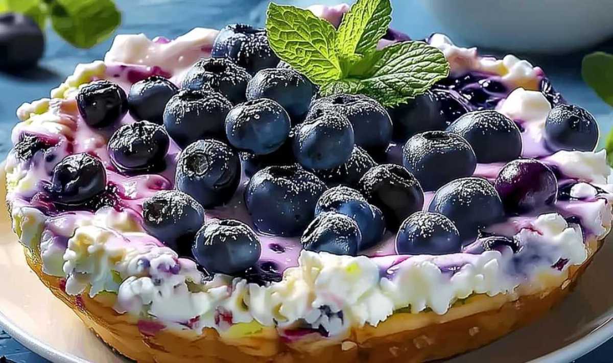 Golden blueberry cottage cheese breakfast bake in 8x8 baking dish fresh from oven