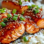 Ginger soy glazed salmon served with rice and steamed vegetables