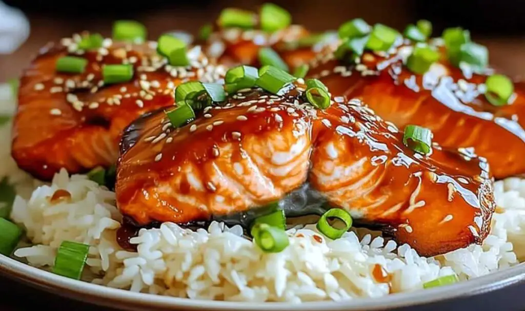 Ginger soy glazed salmon served with rice and steamed vegetables