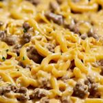 Beef and garlic butter pasta ingredients laid out including ground beef pasta garlic butter