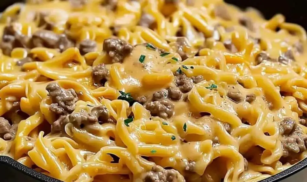 Beef and garlic butter pasta ingredients laid out including ground beef pasta garlic butter