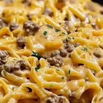 Beef and garlic butter pasta ingredients laid out including ground beef pasta garlic butter