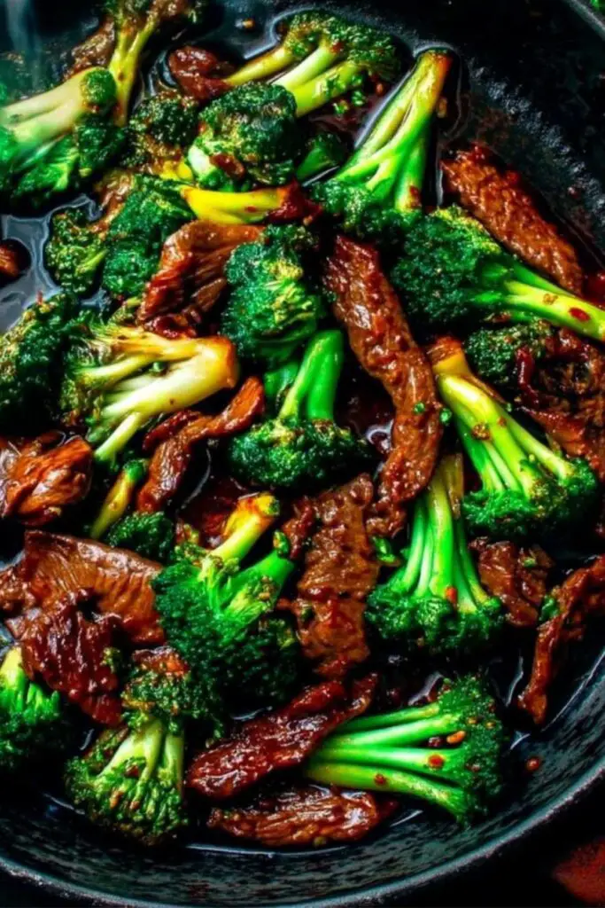Beef and broccoli cooking in wok for Chinese beef and broccoli recipe