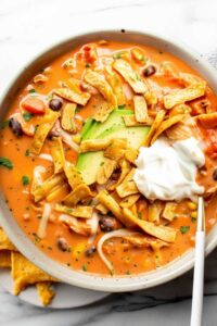 Saut&eacute;ing onions in large pot for creamy chicken tortilla soup recipe