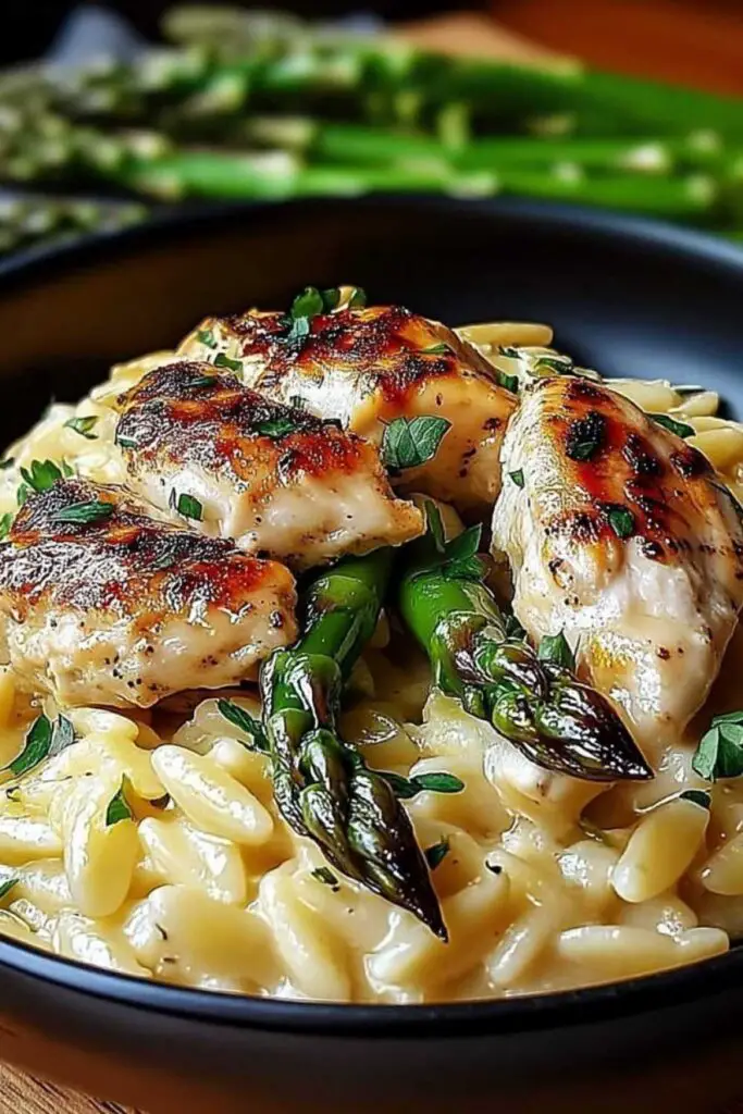 Ingredients for creamy Parmesan orzo chicken including chicken breasts orzo pasta and Parmesan cheese