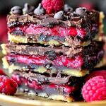 Dark chocolate raspberry pie bar batter spread in baking pan before oven