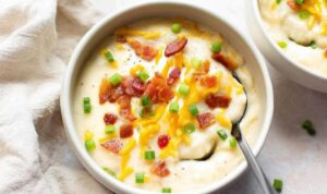 Baked potato soup ingredients including russet potatoes bacon cheese and milk