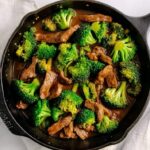 Beef strips cooking in hot skillet for beef and broccoli stir fry