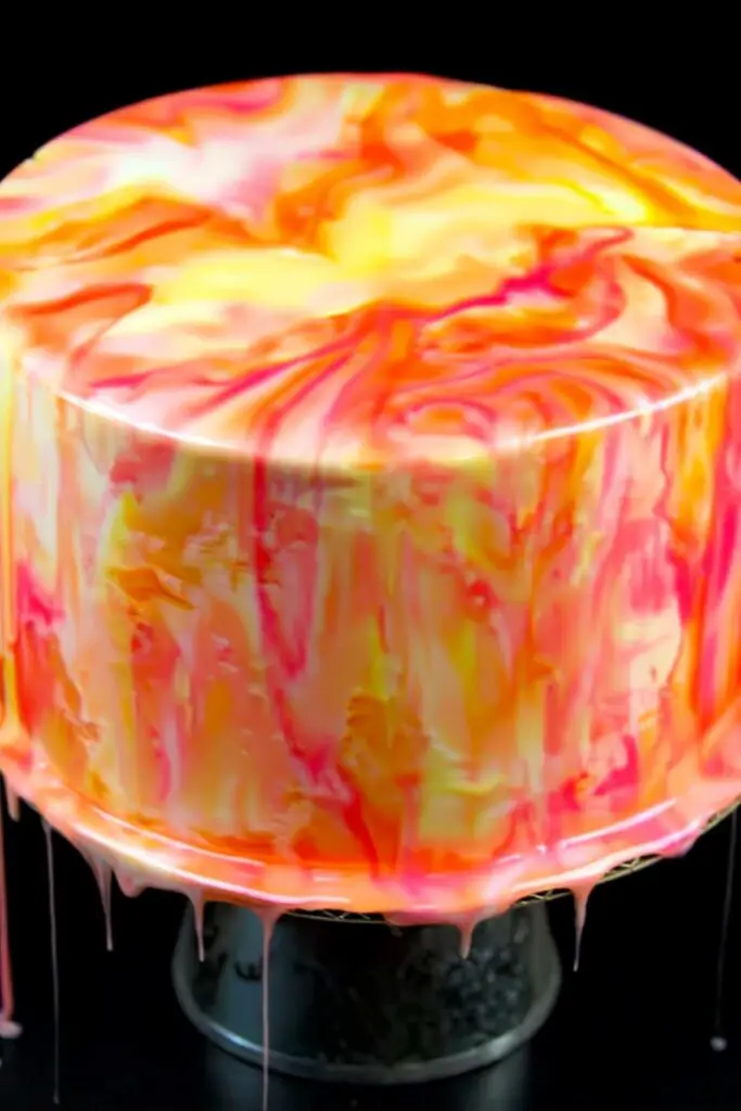 Easy mirror glaze recipe creating stunning shiny rainbow cake with perfect drips