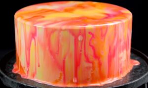 Easy mirror glaze recipe ingredients mixed in bowl showing smooth white chocolate base