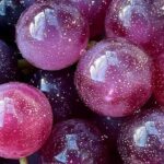 Finished galaxy grapes with cosmic colors and edible glitter on white plate