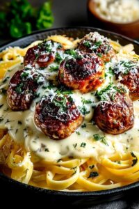 Fresh ingredients for garlic butter meatballs linguine including ground meat, herbs, and pasta