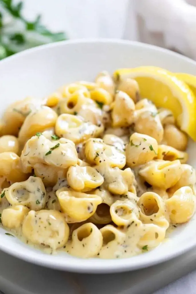 Melting butter with minced garlic in large soup pot for garlic butter pasta