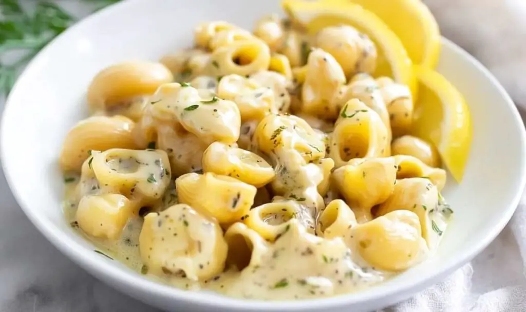 Garlic butter pasta ingredients including fresh garlic, Parmesan cheese, pasta, and herbs