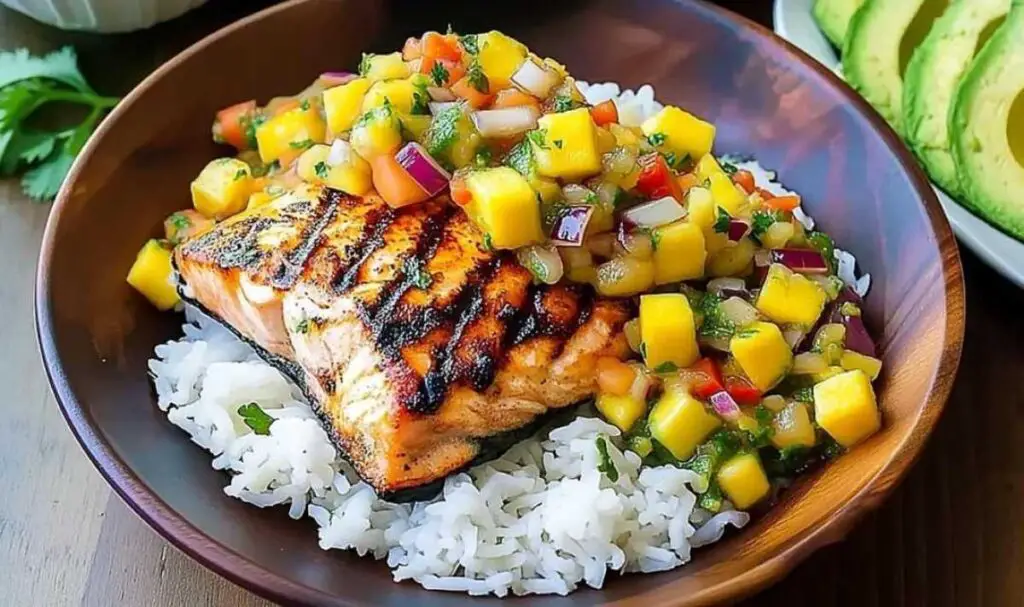 Salmon fillets grilling on grill grates with perfect char marks