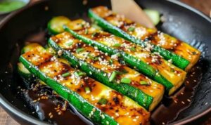 Hibachi zucchini cooking in hot skillet with garlic and ginger
