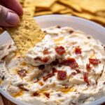 Making No Name Dip Recipe showing creamy base being spread in serving dish