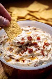Making No Name Dip Recipe showing creamy base being spread in serving dish