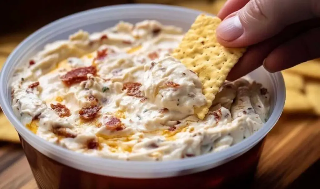 Making No Name Dip Recipe showing creamy base being spread in serving dish