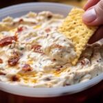 Making No Name Dip Recipe showing creamy base being spread in serving dish