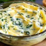 Rich and creamy garlic butter drizzled over pasta and vegetables