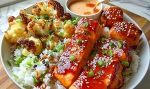 Glazed salmon cooking in skillet with sriracha honey sauce bubbling