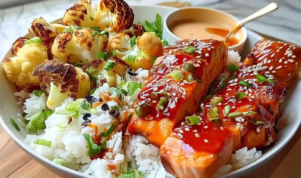 Sriracha honey salmon bowl ingredients laid out including fresh salmon, sriracha sauce, and jasmine rice