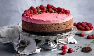 Ingredients for vegan chocolate raspberry mousse cake arranged on marble counter