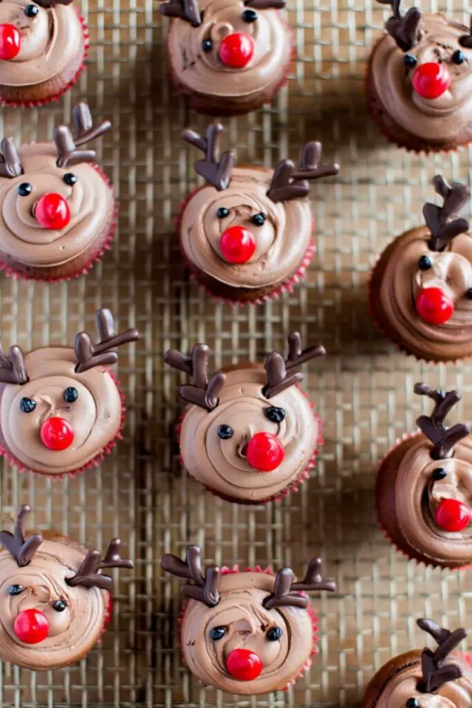 Step by step reindeer cupcake decorating process showing brown frosting swirl and chocolate antler placement