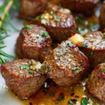 Air Fryer Steak Bites served with roasted vegetables on dinner plate