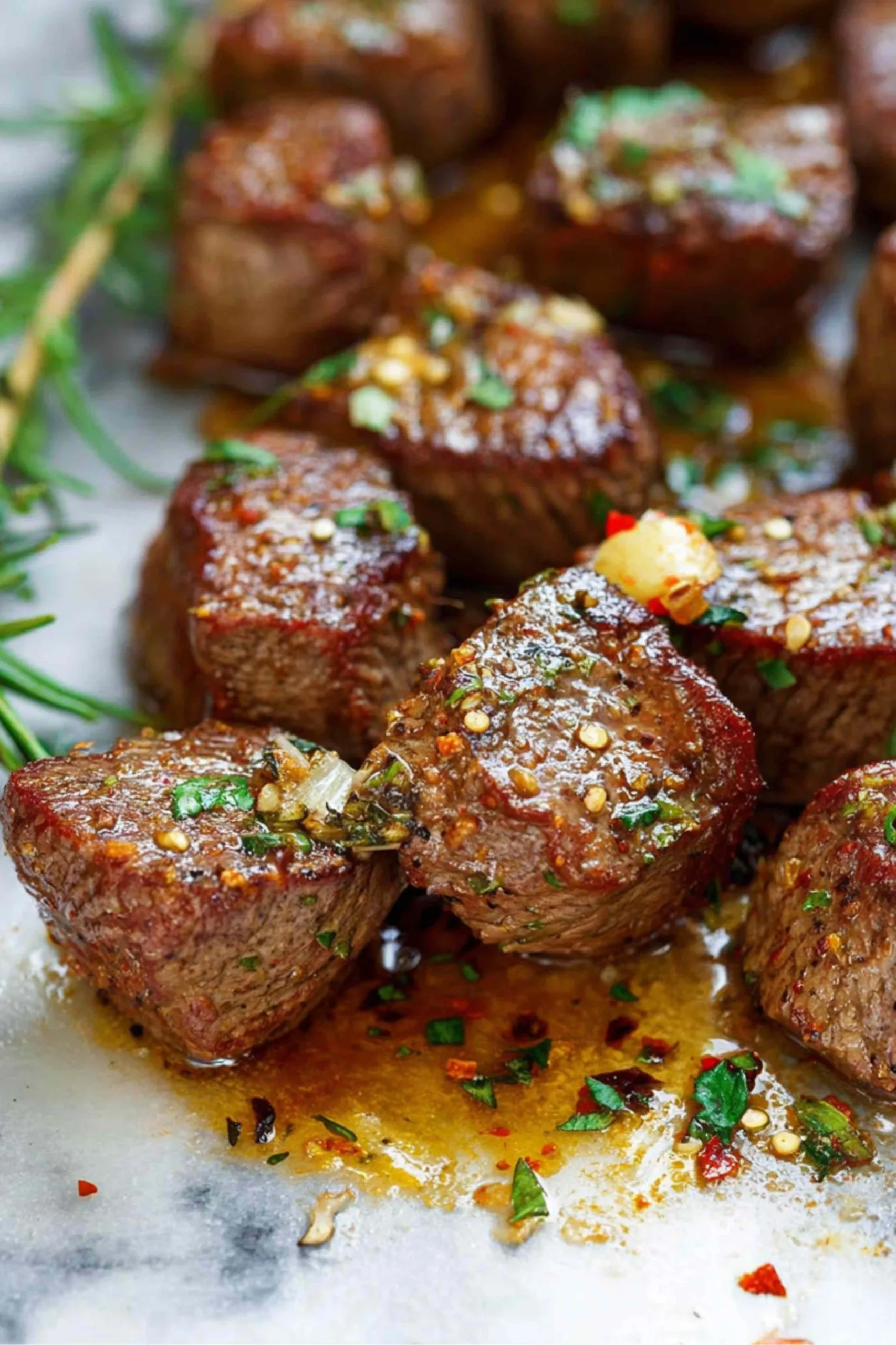 Air Fryer Steak Bites served with roasted vegetables on dinner plate