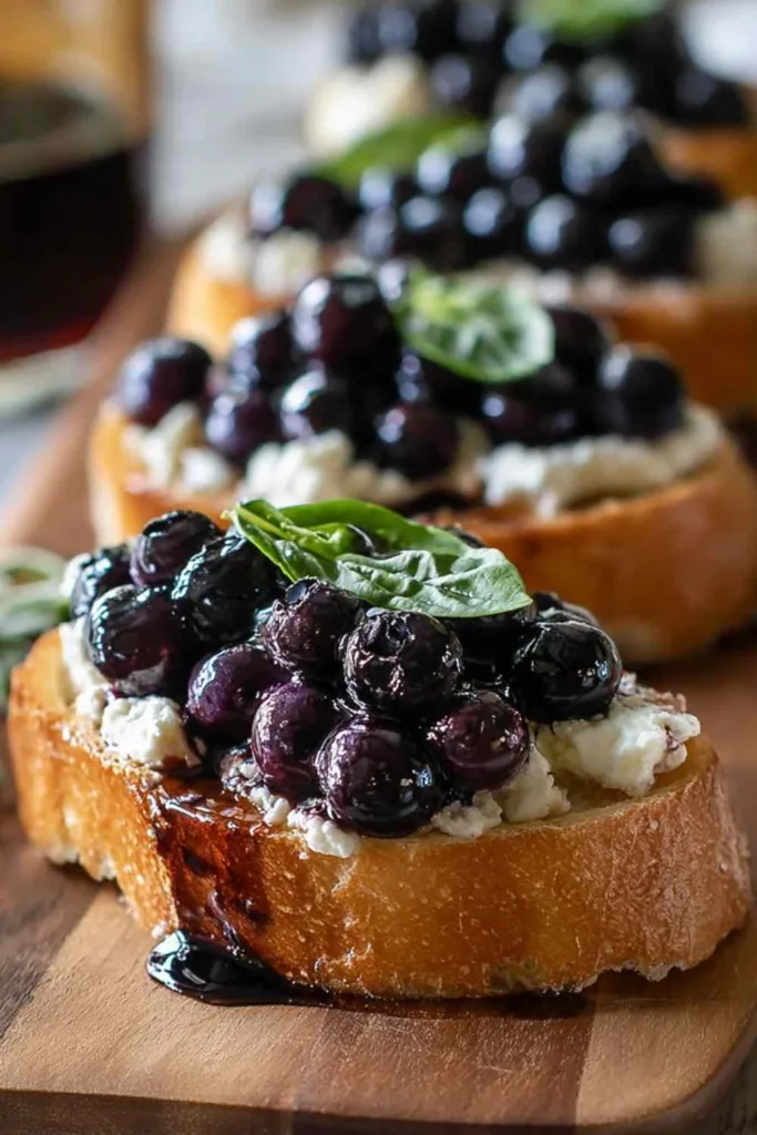 Balsamic blueberry goat cheese crostini on serving platter