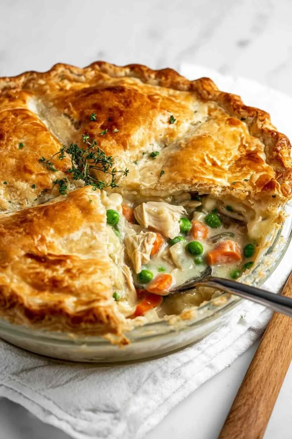Slice of easy chicken pot pie showing layers of crust and filling