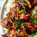 Hawaiian BBQ chicken served with coconut rice avocado and grilled vegetables