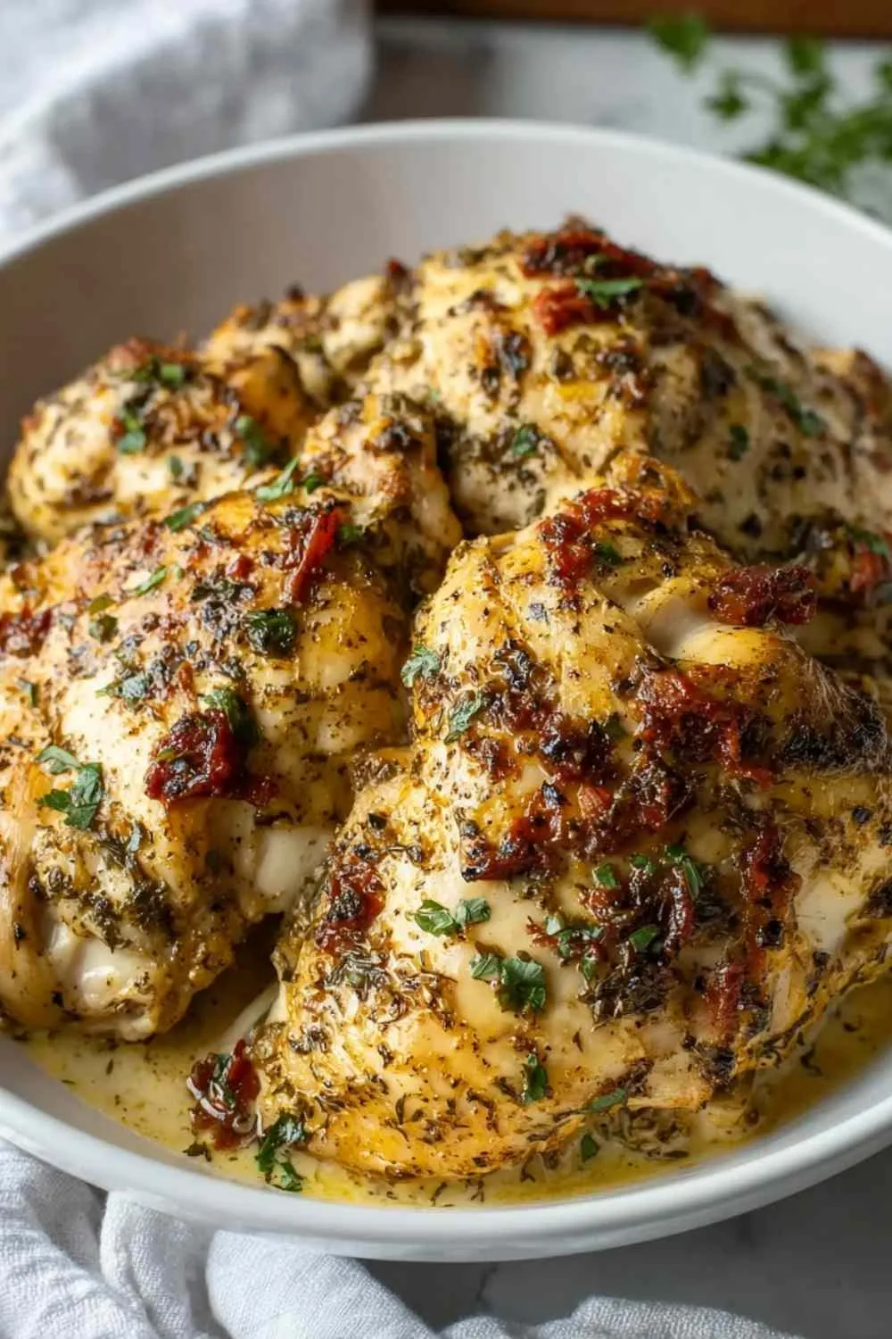 Plated high protein marry me chicken served over cauliflower rice with roasted asparagus