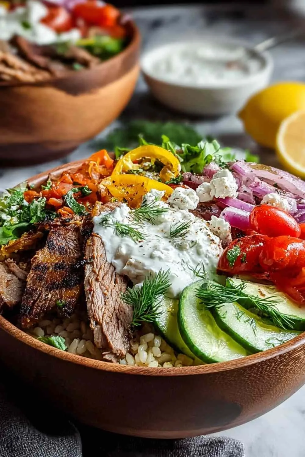 Homemade tzatziki sauce with fresh dill and cucumber for gyro bowls