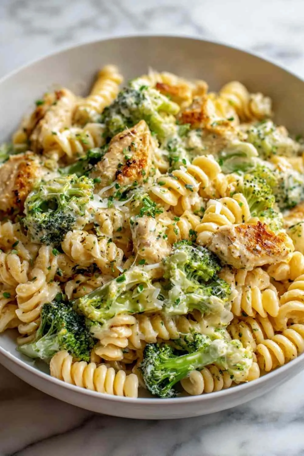 Creamy Rotisserie Chicken Broccoli Pasta in white bowl