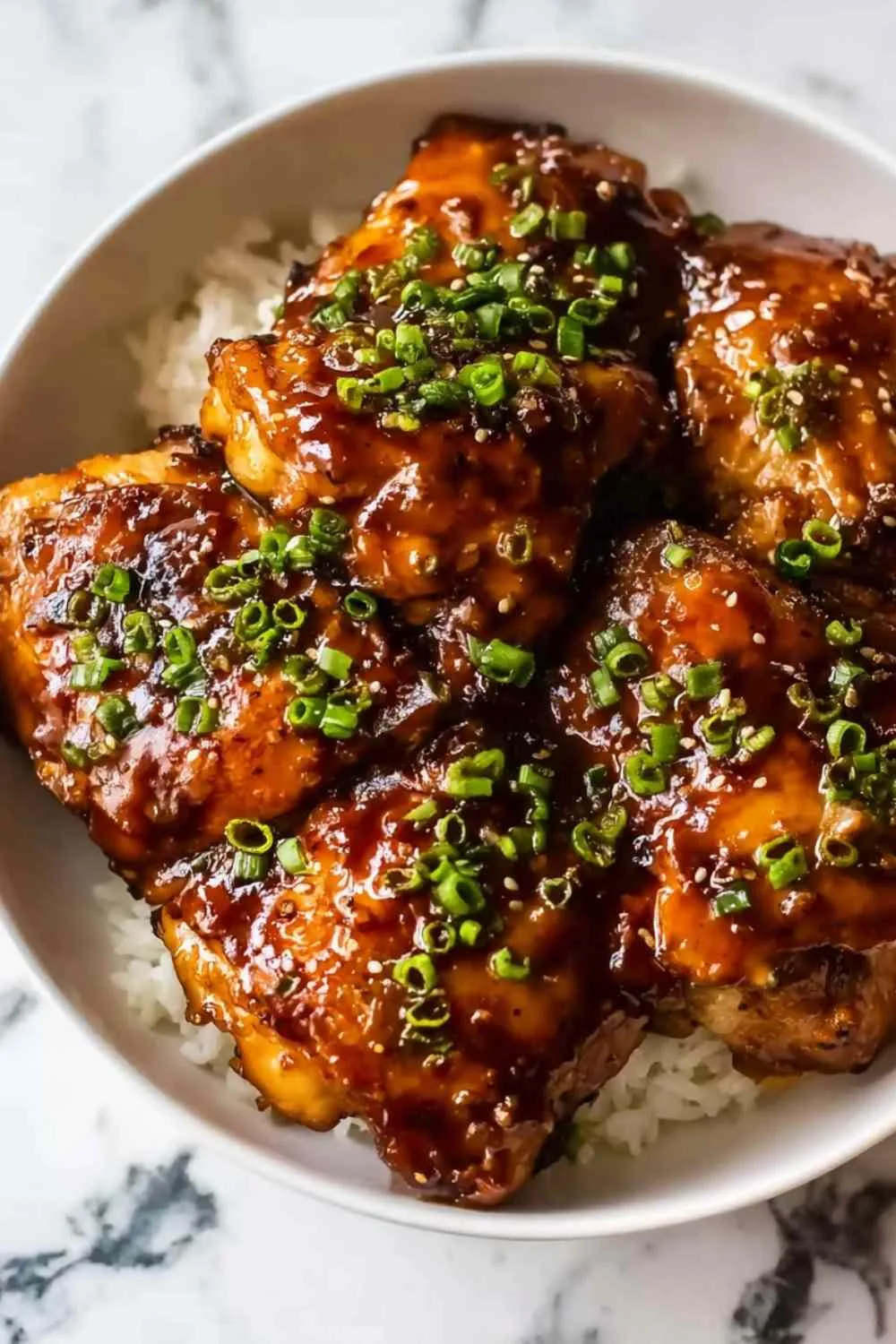 Slow Cooker Honey Garlic Chicken served over steamed jasmine rice