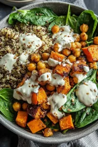 Ingredients for Anti-Inflammatory Glow Bowl laid out on a wooden counter including quinoa and sweet potatoes