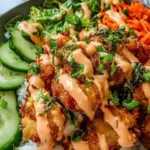Bang Bang Chicken Rice Bowl with crispy chicken tenders and creamy bang bang sauce